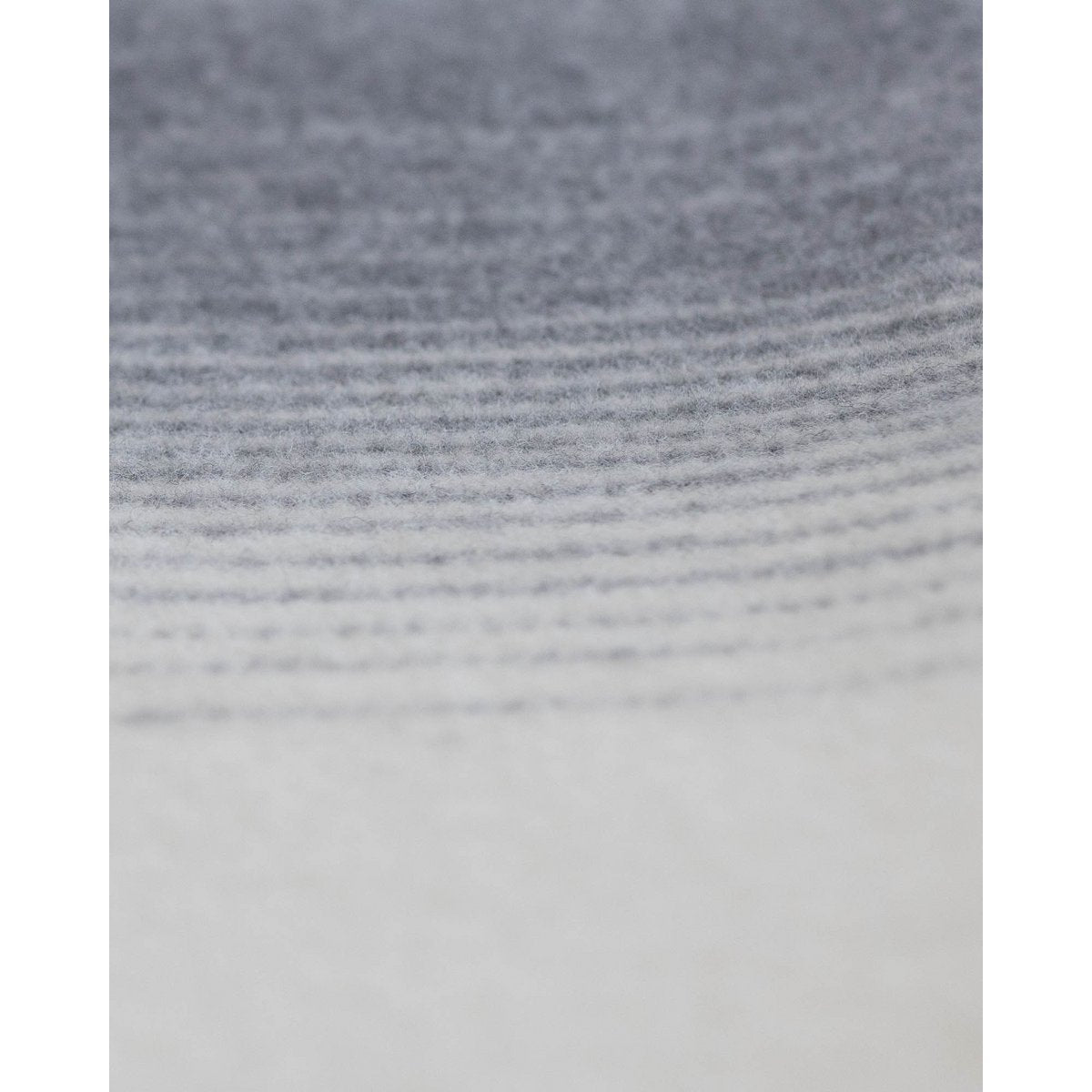 Ivory Mist bedspread folded at the foot of a bed