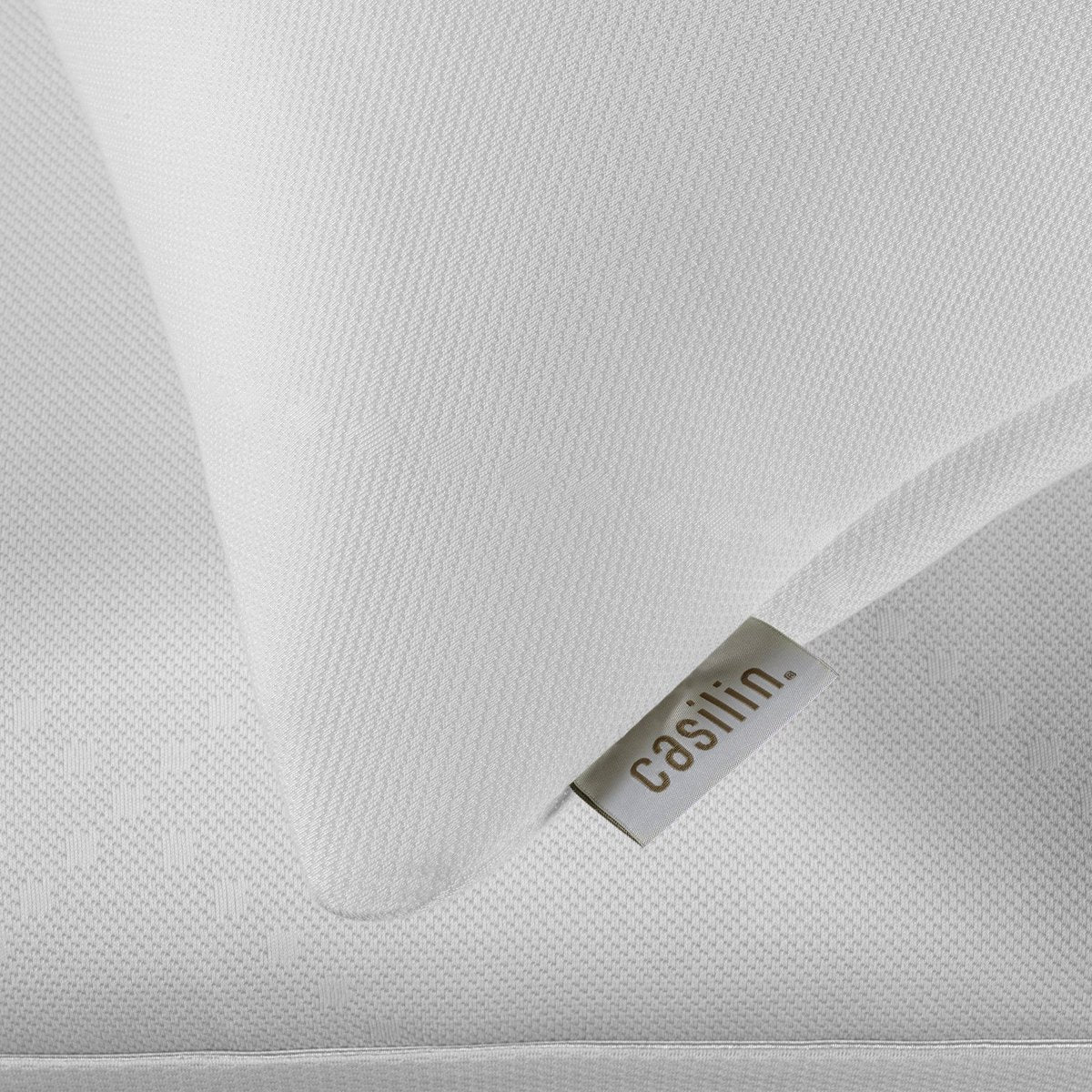 Close-up of the Air Cover pillow protector fabric and label