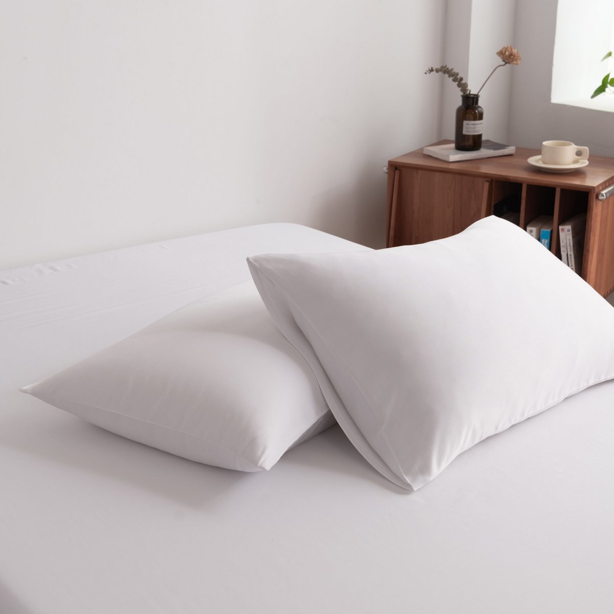 Close-up of Coco White bamboo pillowcases arranged on the bed