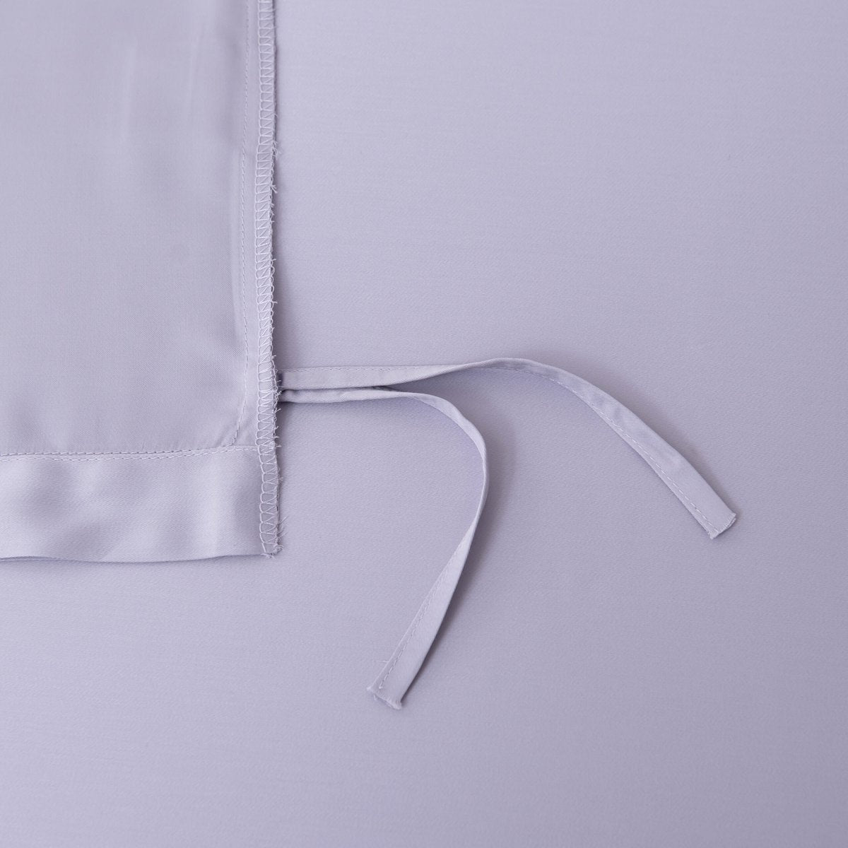 Close-up of a tie/closure detail on the Lavender Mist bamboo bedding