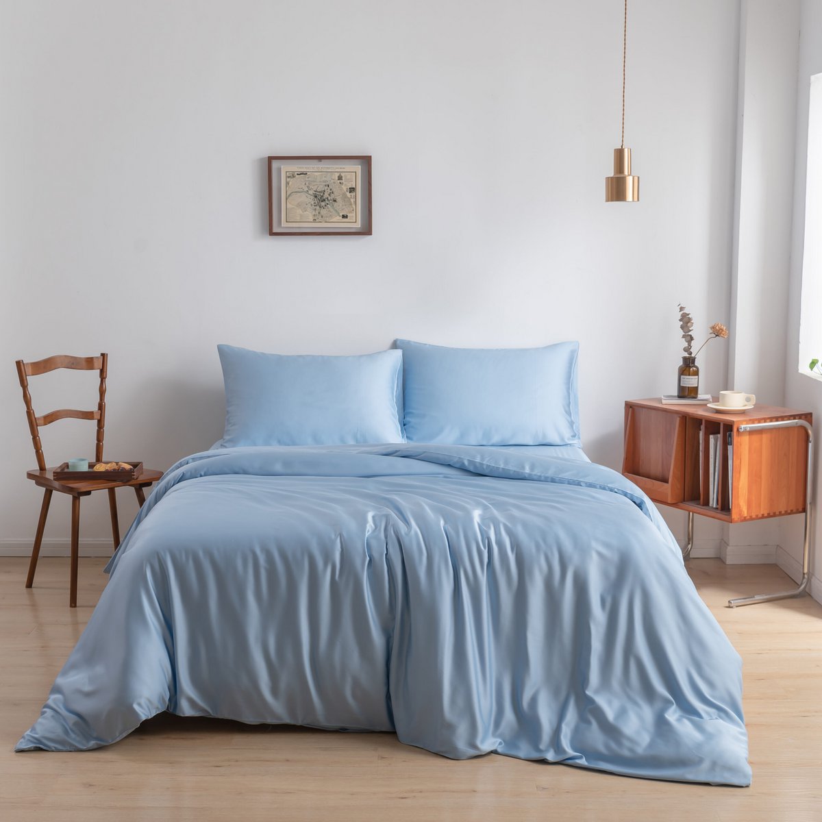 Sky Blue bamboo bedding set on a wood-framed bed