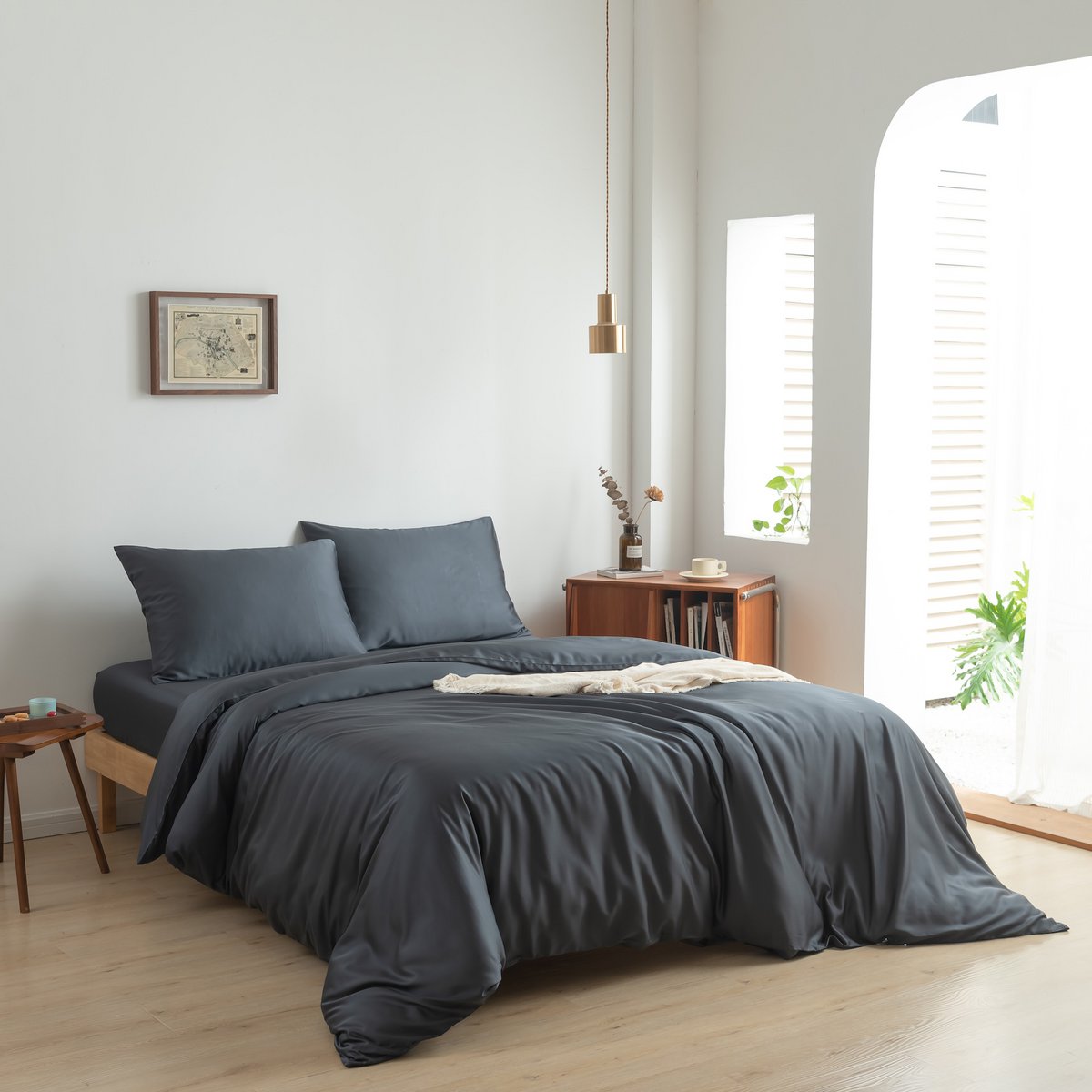 Space Blue bamboo bedding set on a made bed