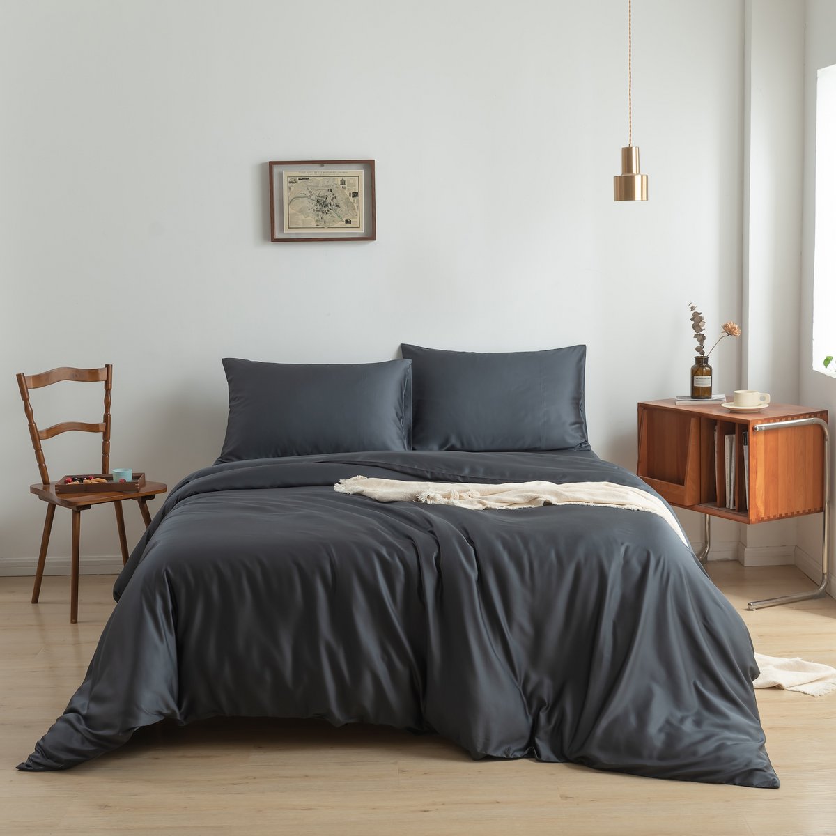 Space Blue bamboo bedding set styled on a bed in a bedroom setting