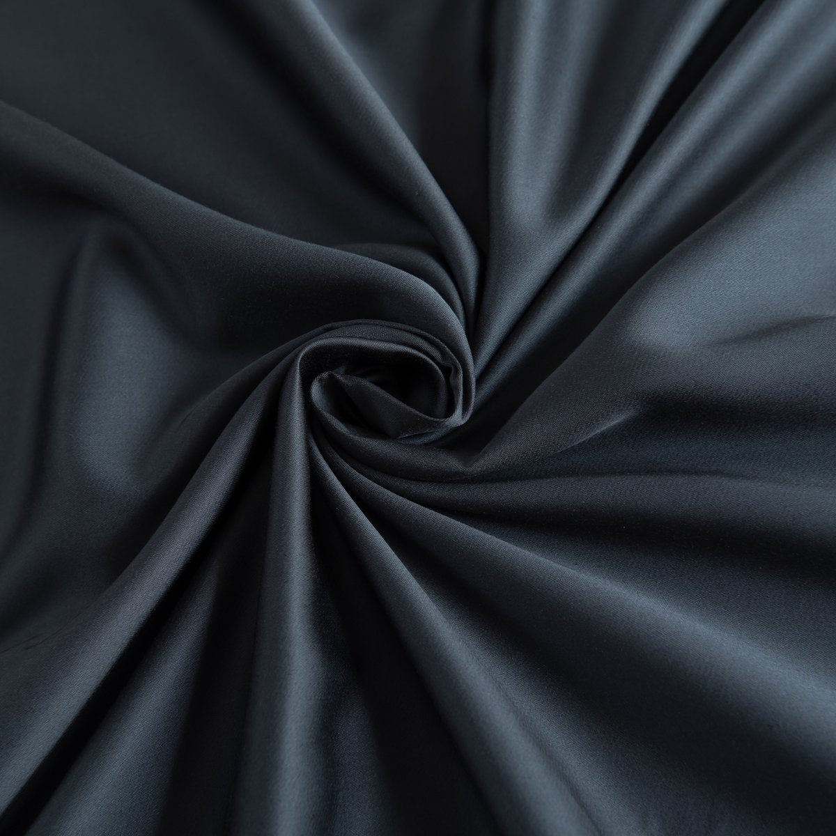 Draped Space Blue bamboo fabric showing its soft, silky finish