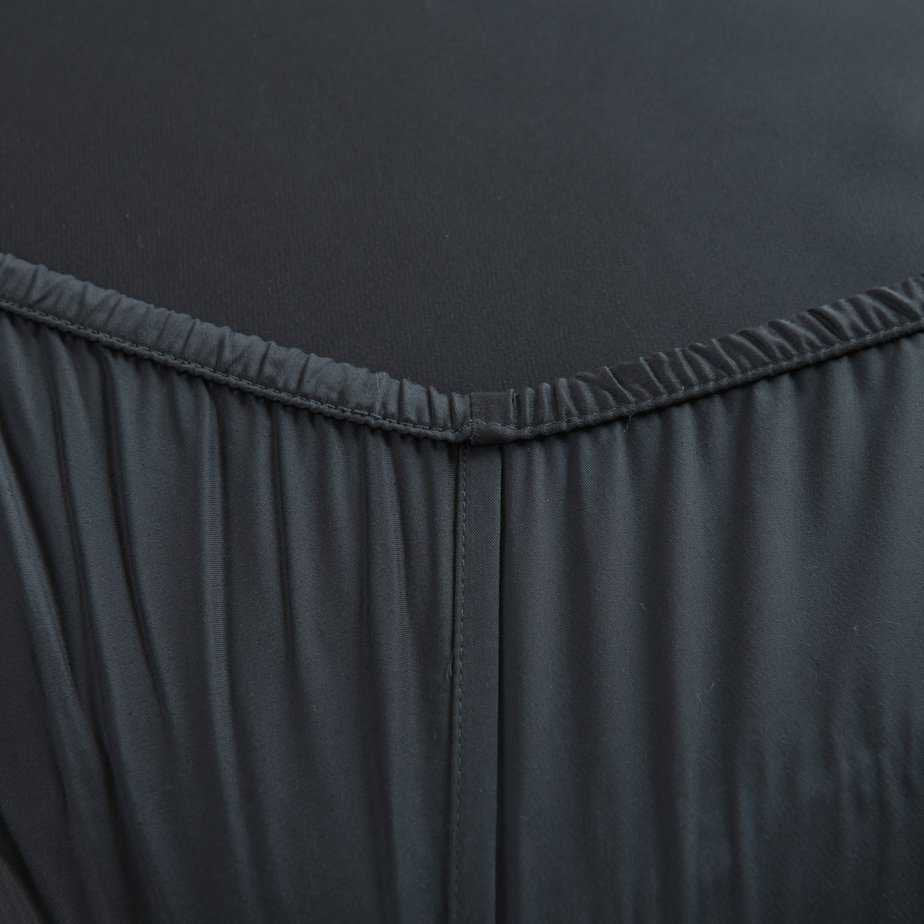 Space Blue bamboo fitted sheet showing its soft, gathered elastic edge