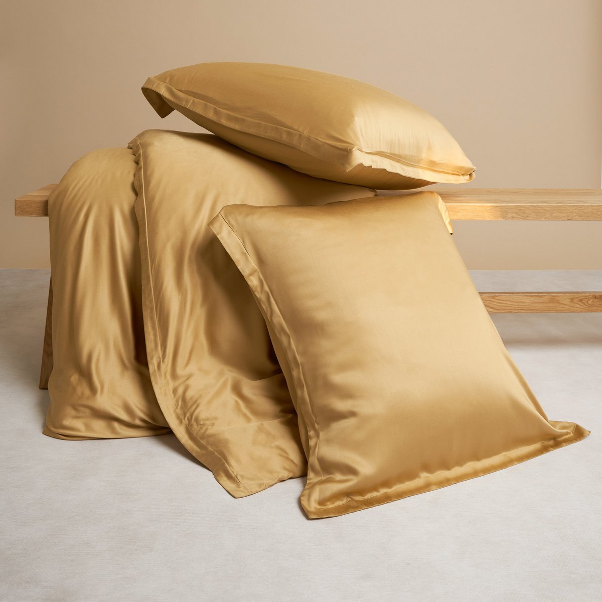 Bamboo Duvet Cover in Ocher Yellow draped with matching pillowcases