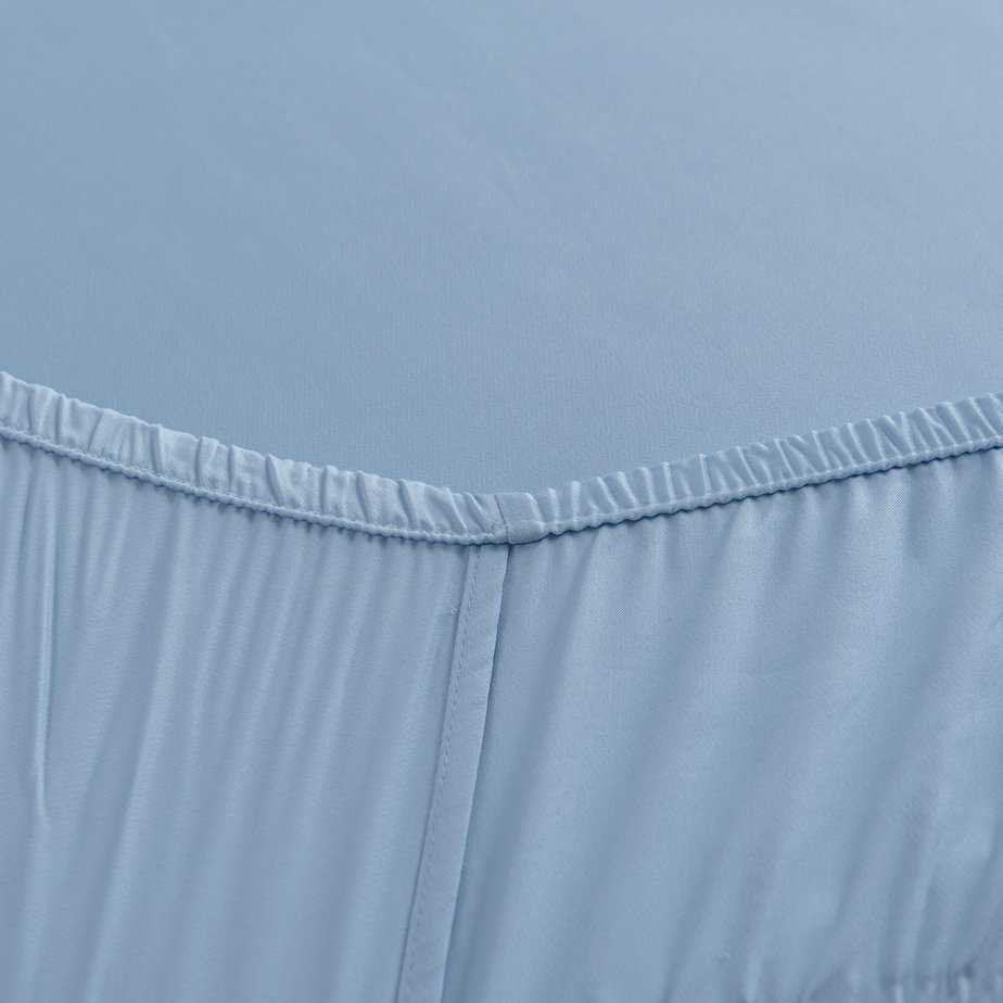 Close-up of the stitched elastic hem on the Sky Blue bamboo fitted sheet