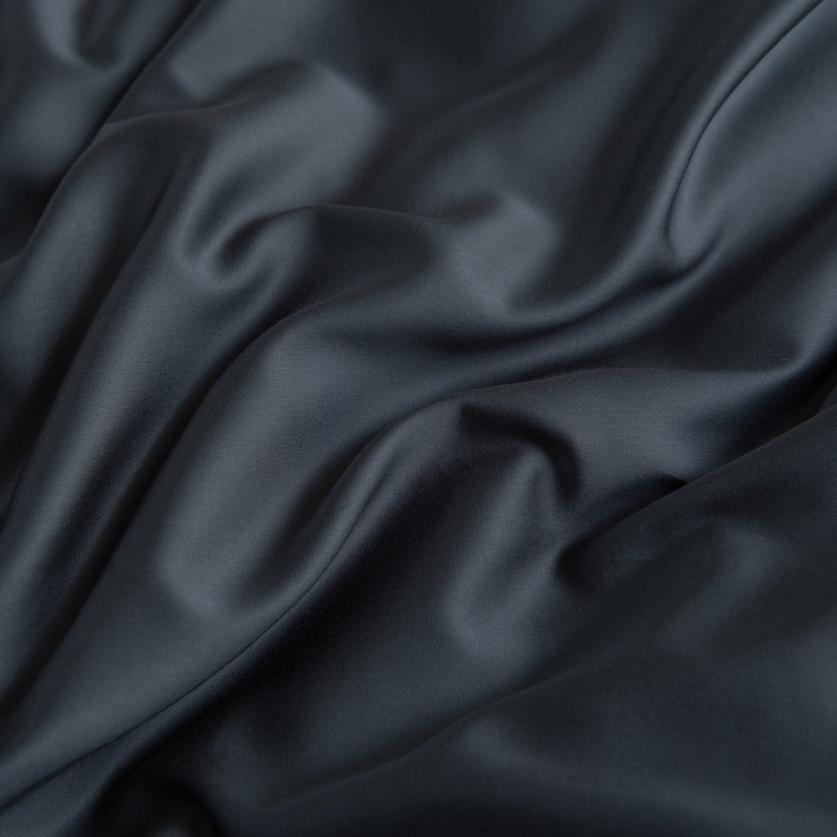 Close-up of draped Space Blue bamboo fabric highlighting its soft sheen.