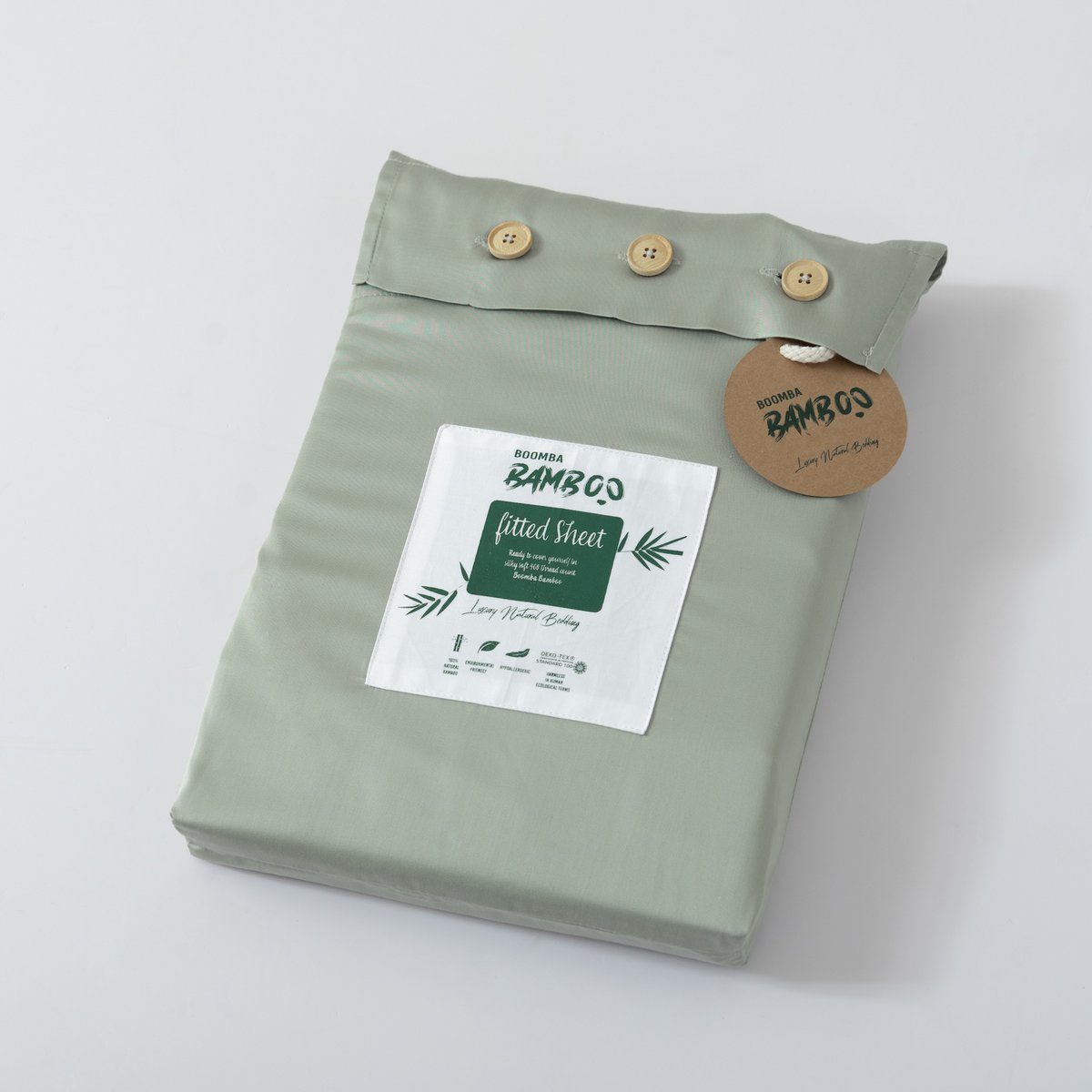 Sage Green bamboo fitted sheet folded and packaged with the Boomba Bamboo product label.
