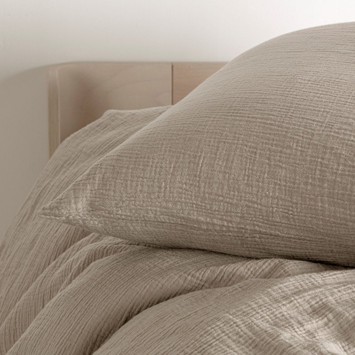 Cotton muslin duvet cover in beige, close-up texture