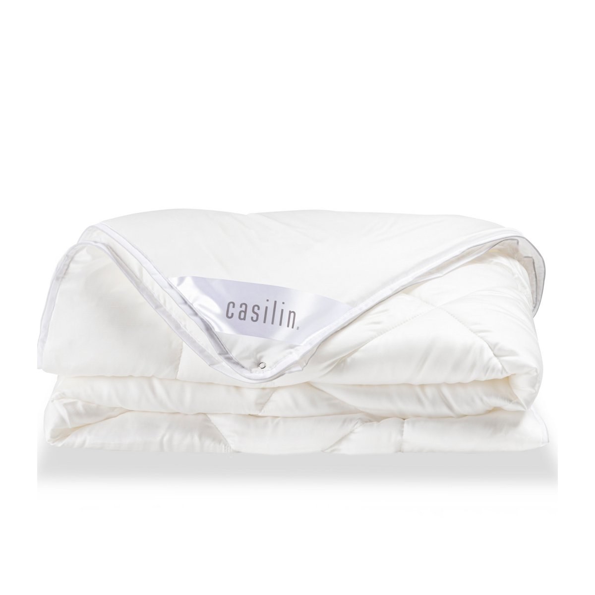 Folded white Tencel satin Super Soft Duo duvet with the Casilin label and press-stud corner visible