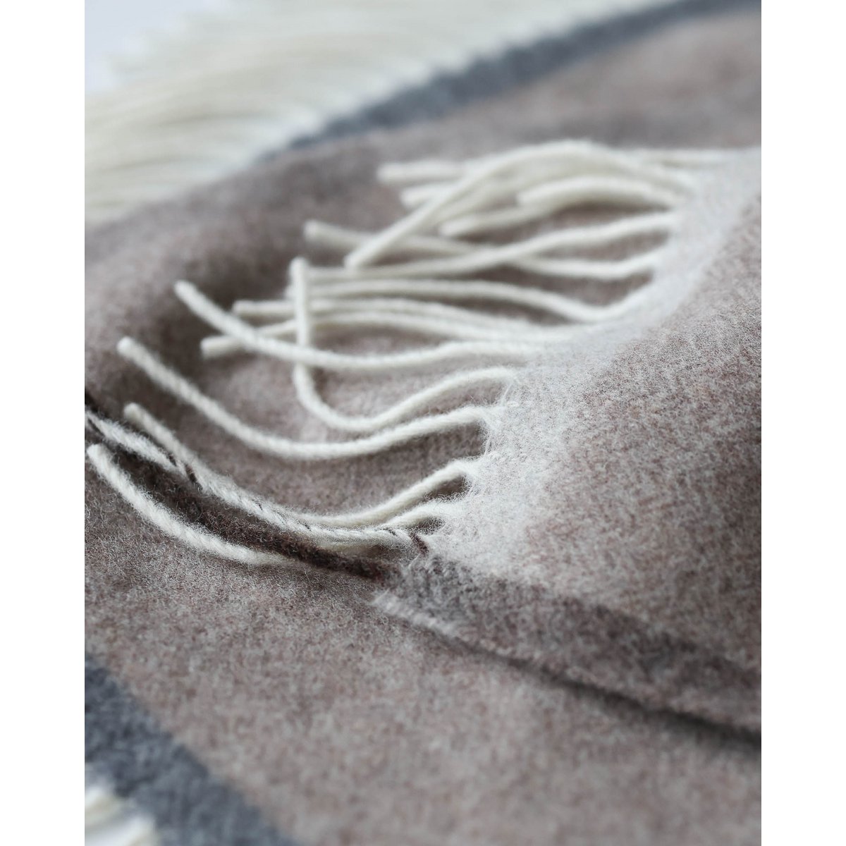 Detail shot of the Milano throw's fringe and weave