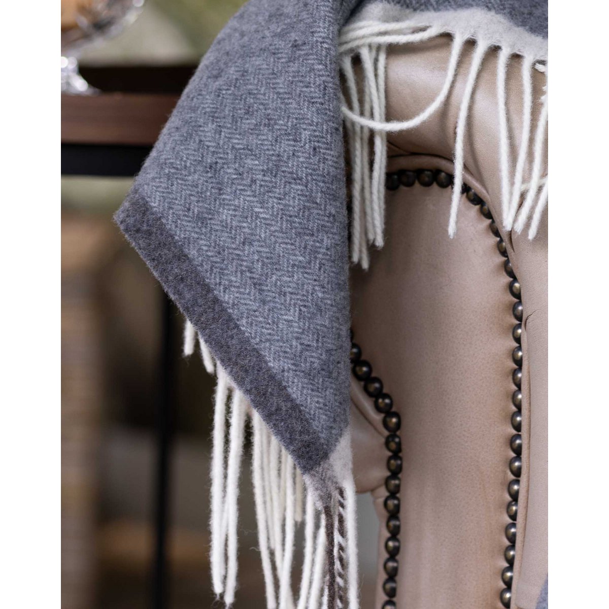 Detail shot of the Milano Grigio Orlo throw's fringe and weave