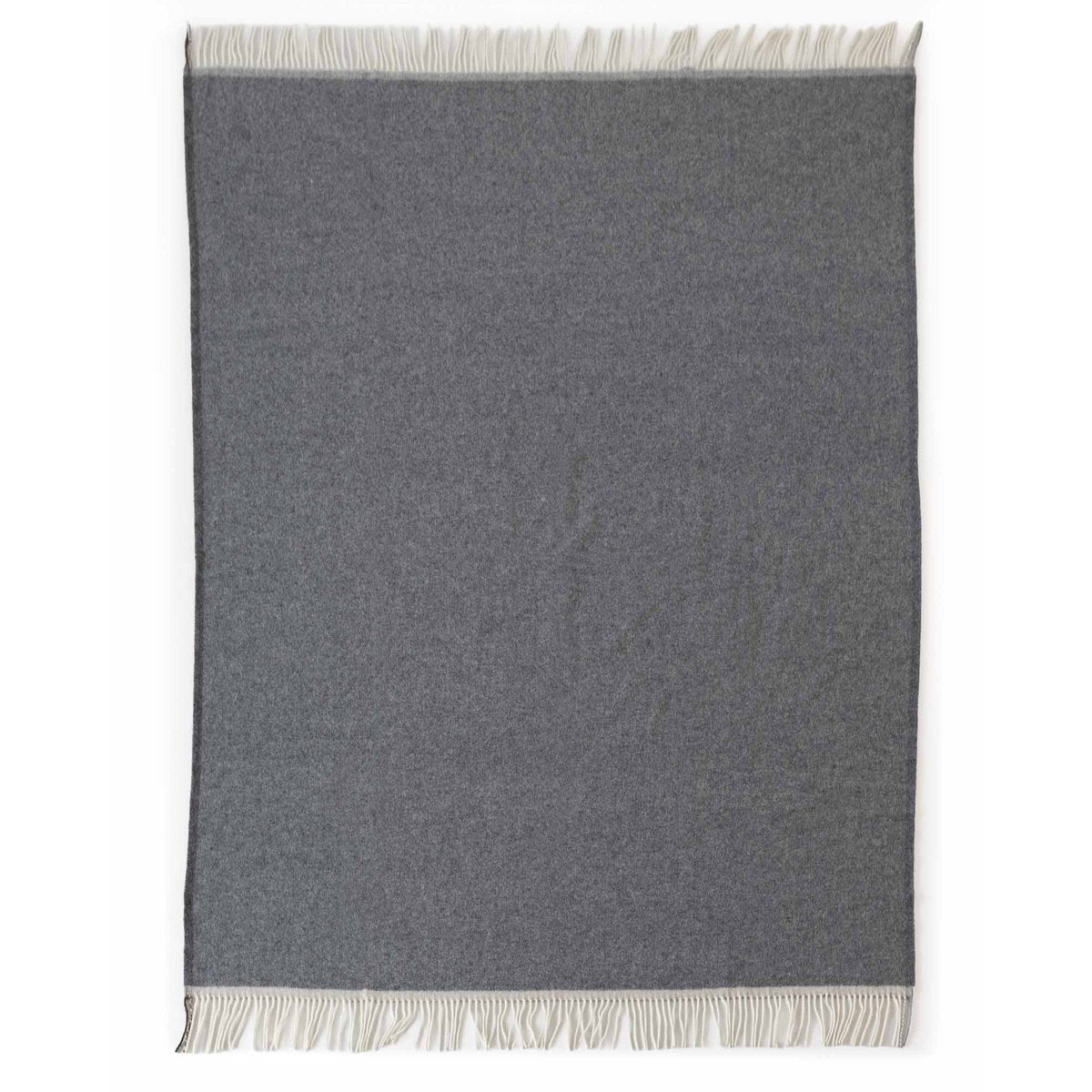Merino & Cashmere Throw Blanket Milano Grigio Orlo styled in a room setting