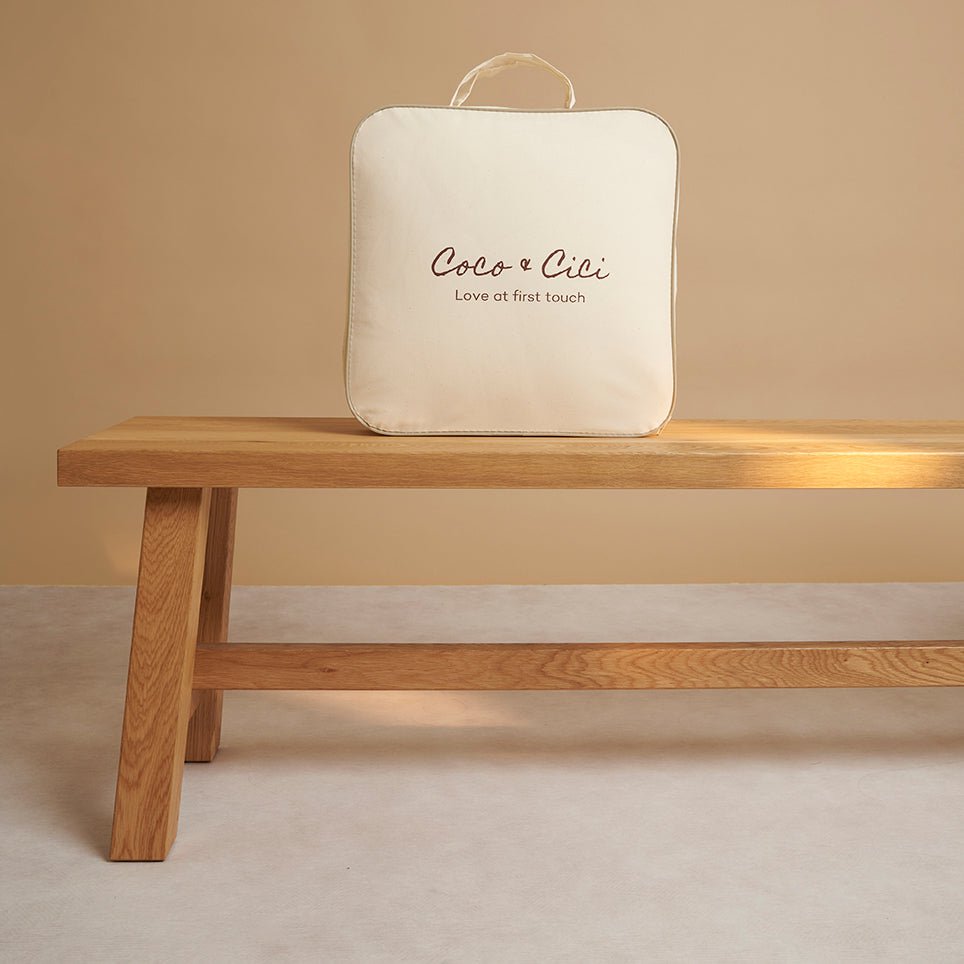 Tencel™ Four Seasons Duvet folded beside its reusable canvas storage bag