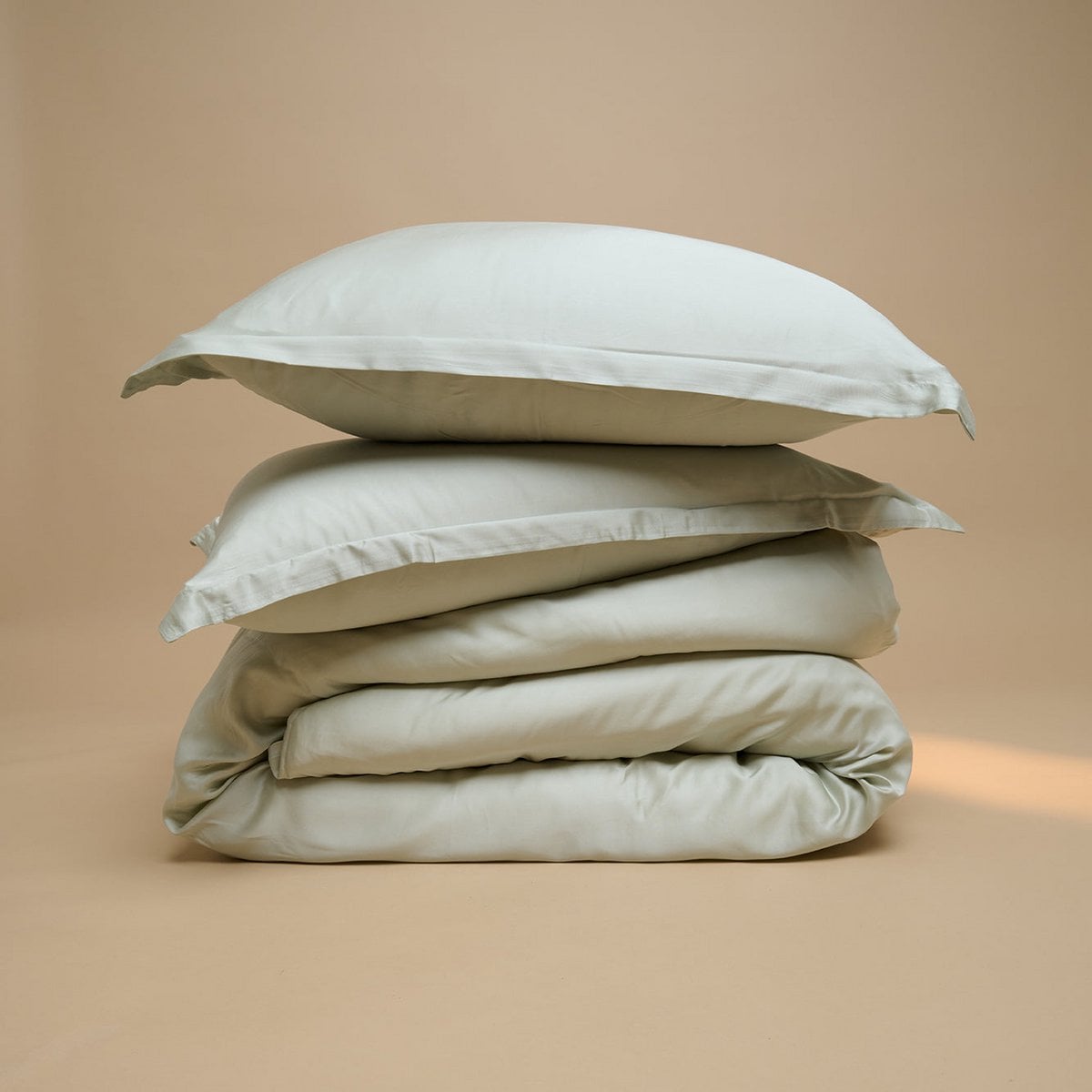 Tencel™ Sateen Duvet Cover and pillow in Gray Green, folded