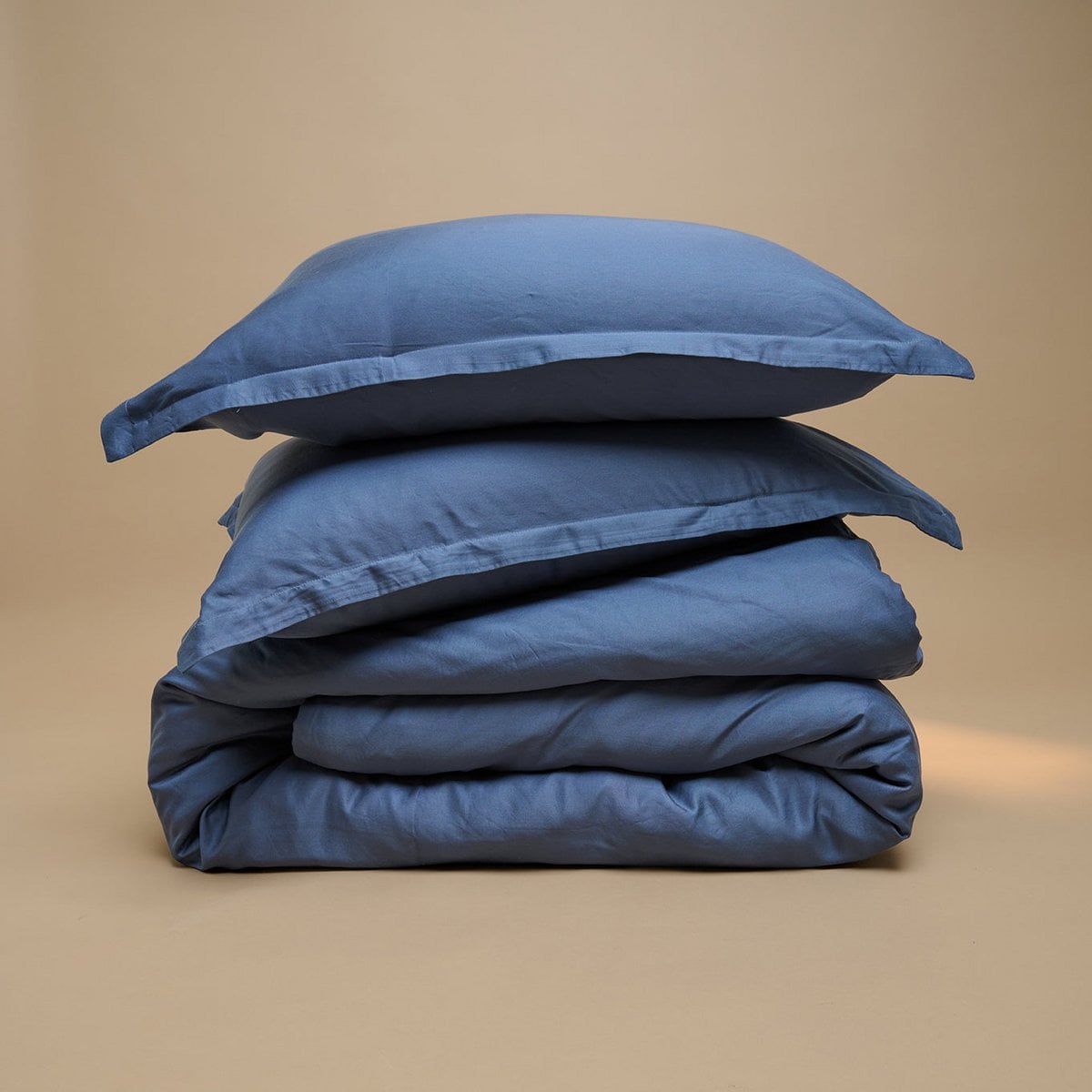 Tencel™ Twill Duvet Cover and pillows in Dark Blue, folded