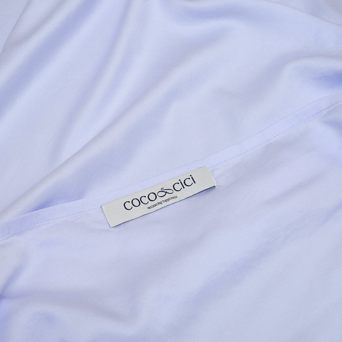 Close-up of the Coco & Cici brand label on the Tencel™ Twill Pillowcase in Lavender Blue