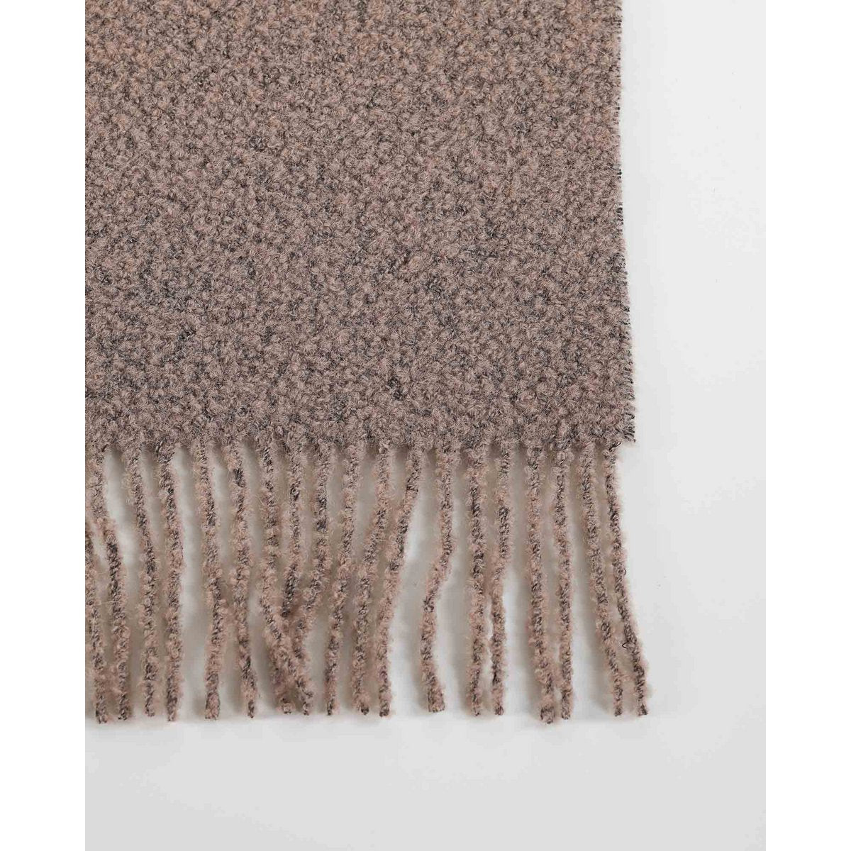 Close-up of Paris throw's bouclé texture in cappuccino