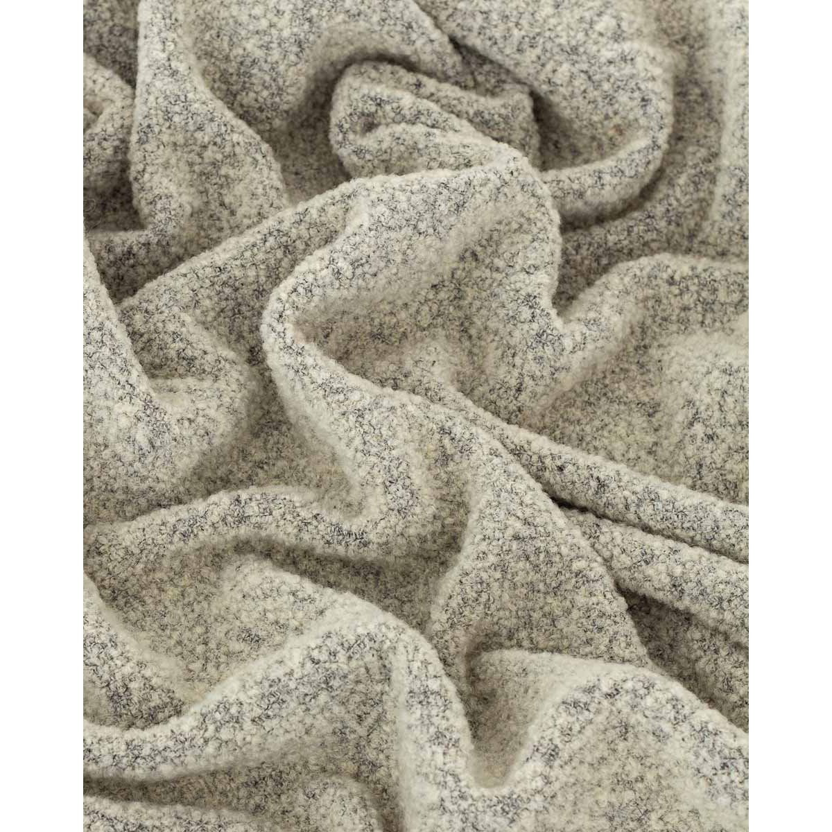 Close-up of Paris throw's bouclé texture in ivory