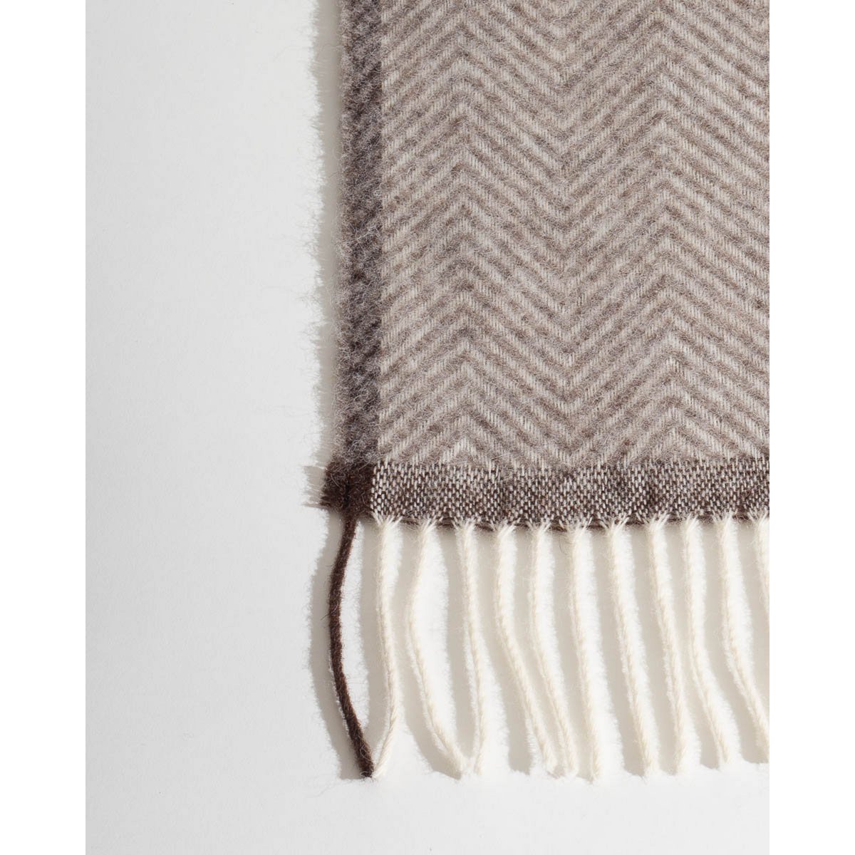 Detail of Denver throw's zigzag woven texture in beige