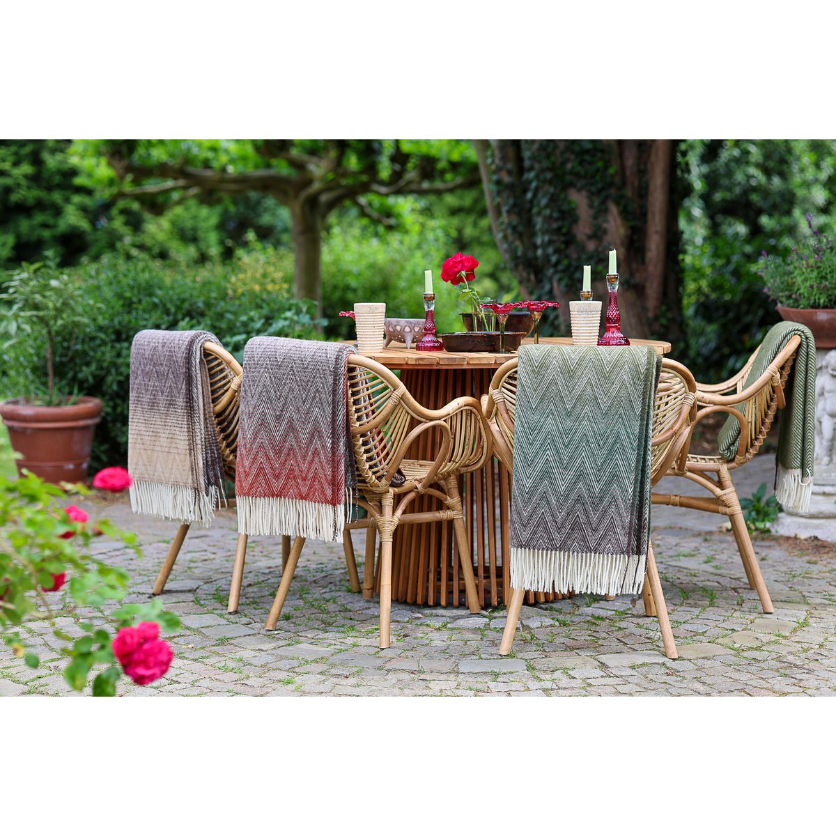 Wool Throw Blanket Manoria Foresta draped in an outdoor setting 02