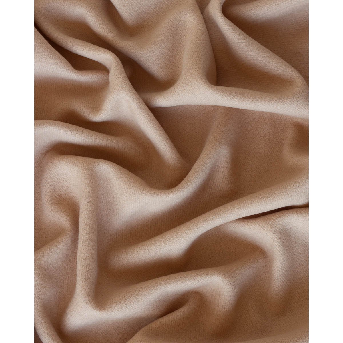 Close-up of Rio throw's woven beige wool texture