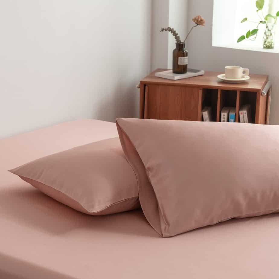 Cuddle Pink bamboo bedding set styled on a made bed