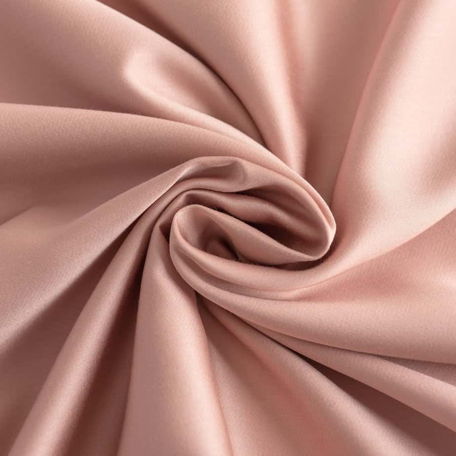 Draped Cuddle Pink bamboo fabric showing its soft, silky finish