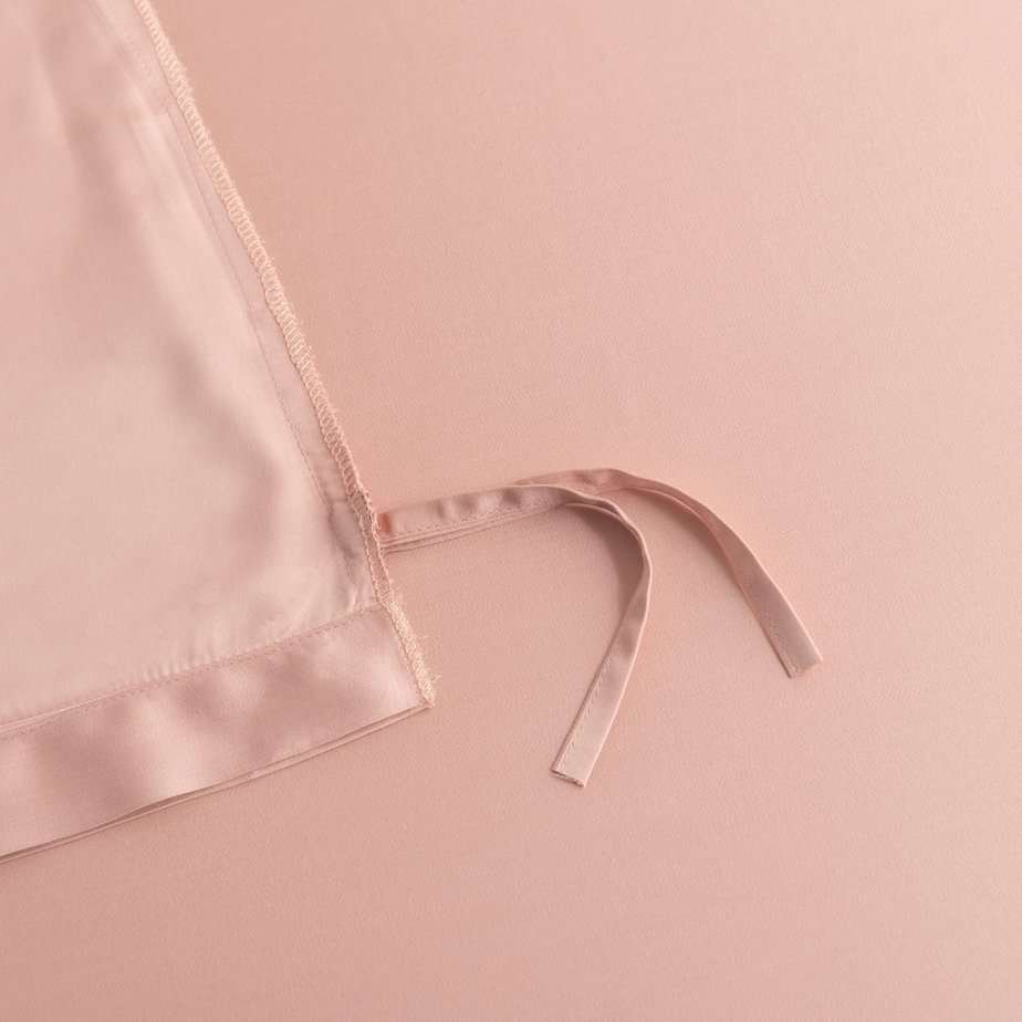 Close-up of a tie/closure detail on the Cuddle Pink bamboo bedding