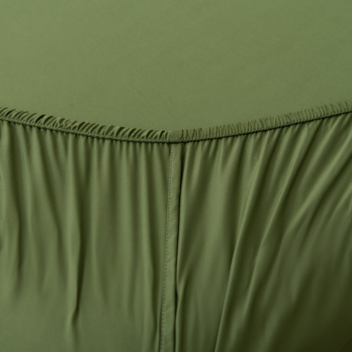 Folded Deep Moss bamboo fabric showing its natural sheen