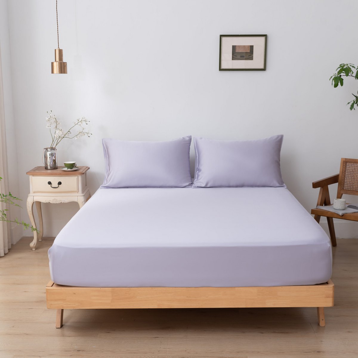 Lavender Mist bamboo bedding set on a bed, corner view