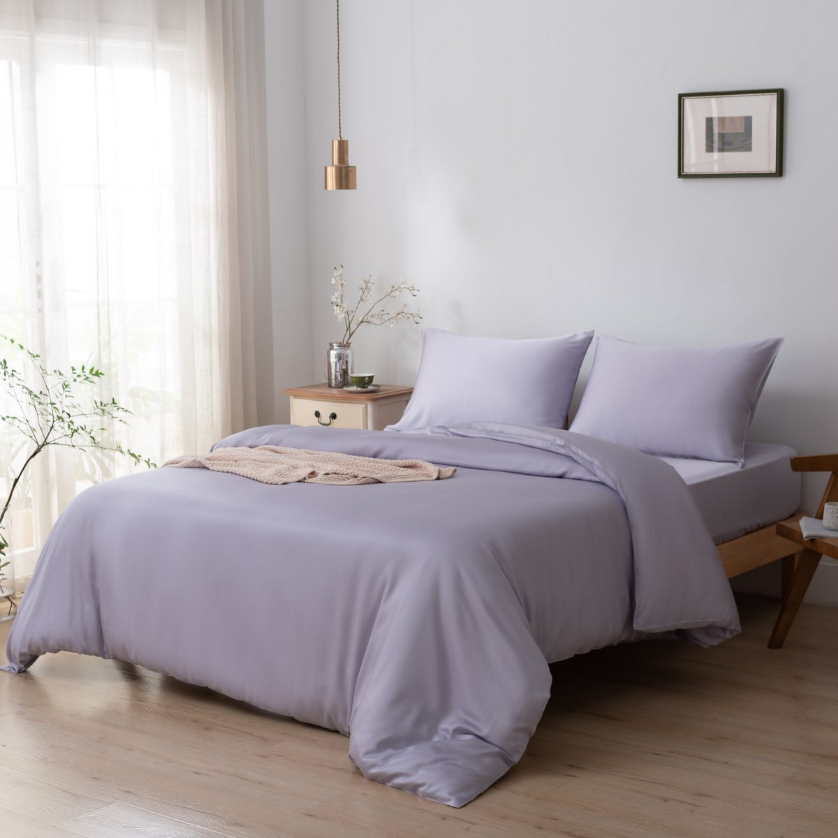 Lavender Mist bamboo bedding set styled on a bed by a window