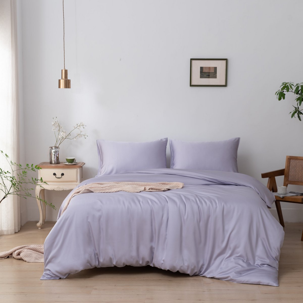 Lavender Mist bamboo bedding set on a wood-framed bed