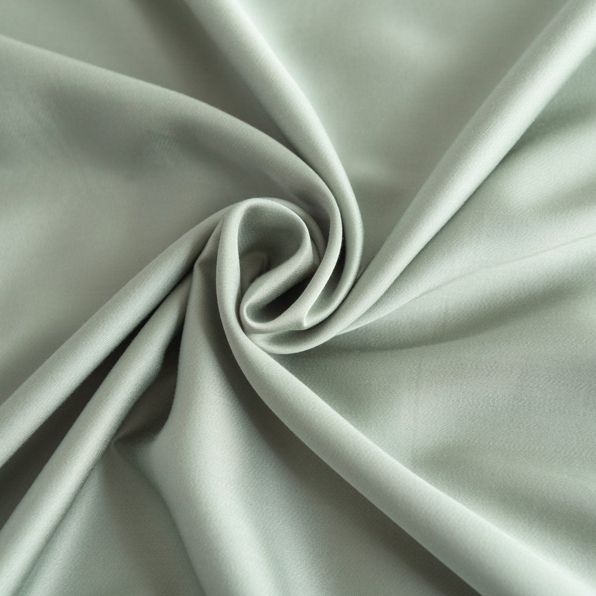 Draped Sage Green bamboo fabric showing its soft, silky finish