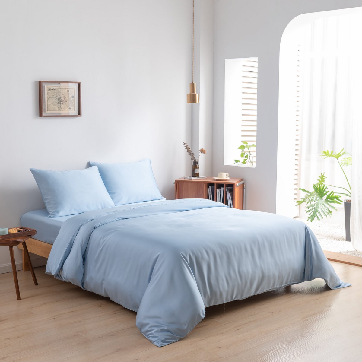 Sky Blue bamboo bedding set on a made bed