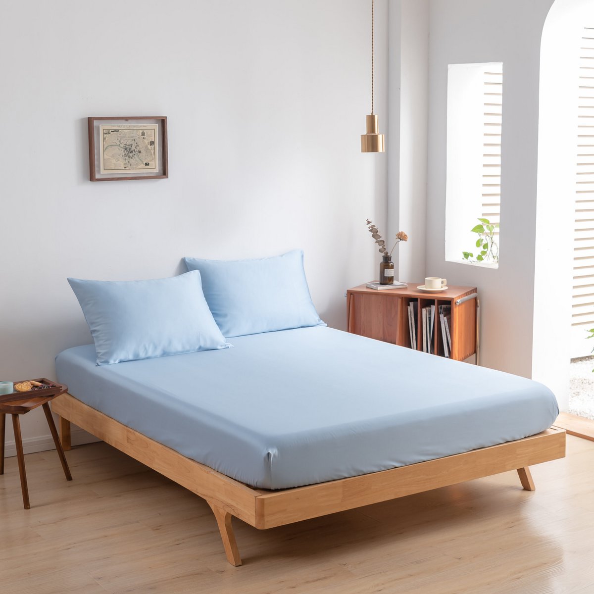 Sky Blue bamboo bedding set styled with a nightstand