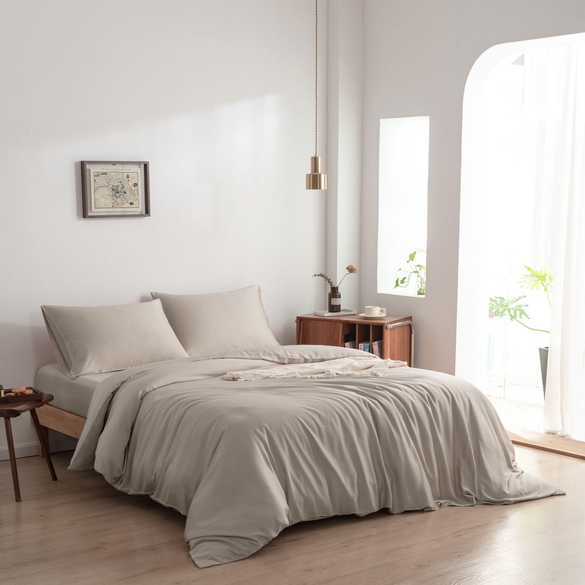 Soft Taupe bamboo bedding set styled on a bed by a window