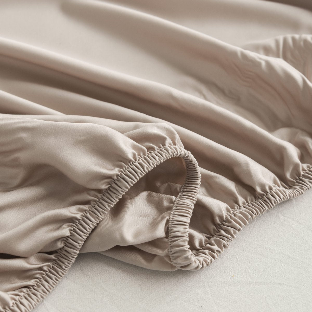 Folded Soft Taupe bamboo fabric showing its natural sheen