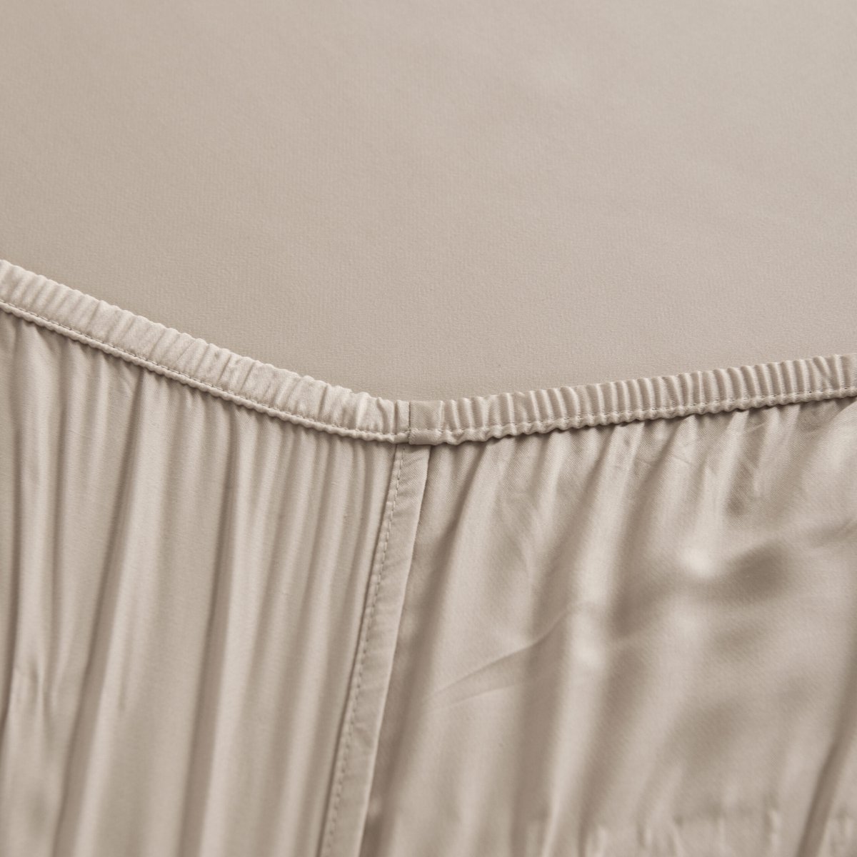 Soft Taupe bamboo fitted sheet showing its soft, gathered elastic edge