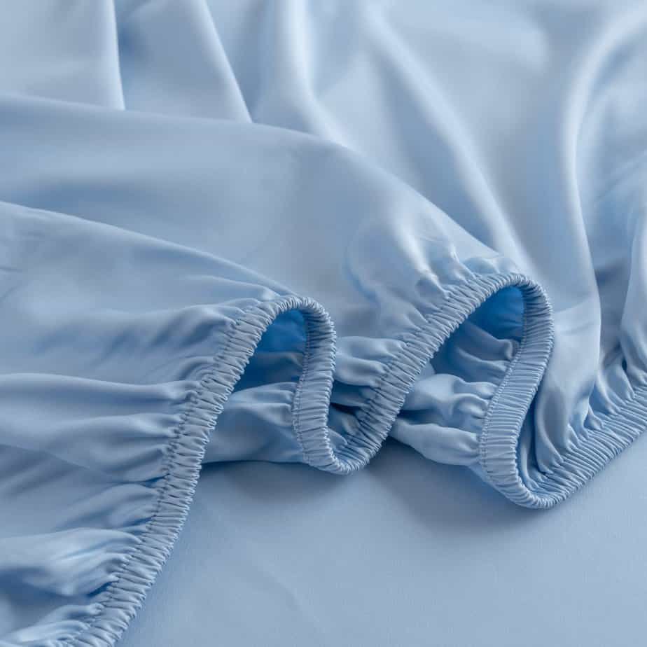 Sky Blue bamboo fitted sheet folded to show the elasticated corner
