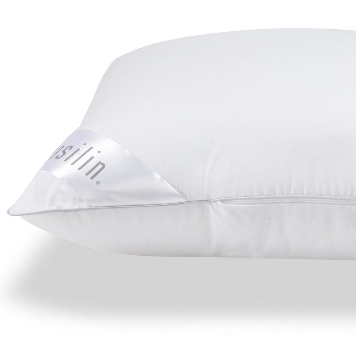 White Casilin pillow, close-up of the corner with branded label tag