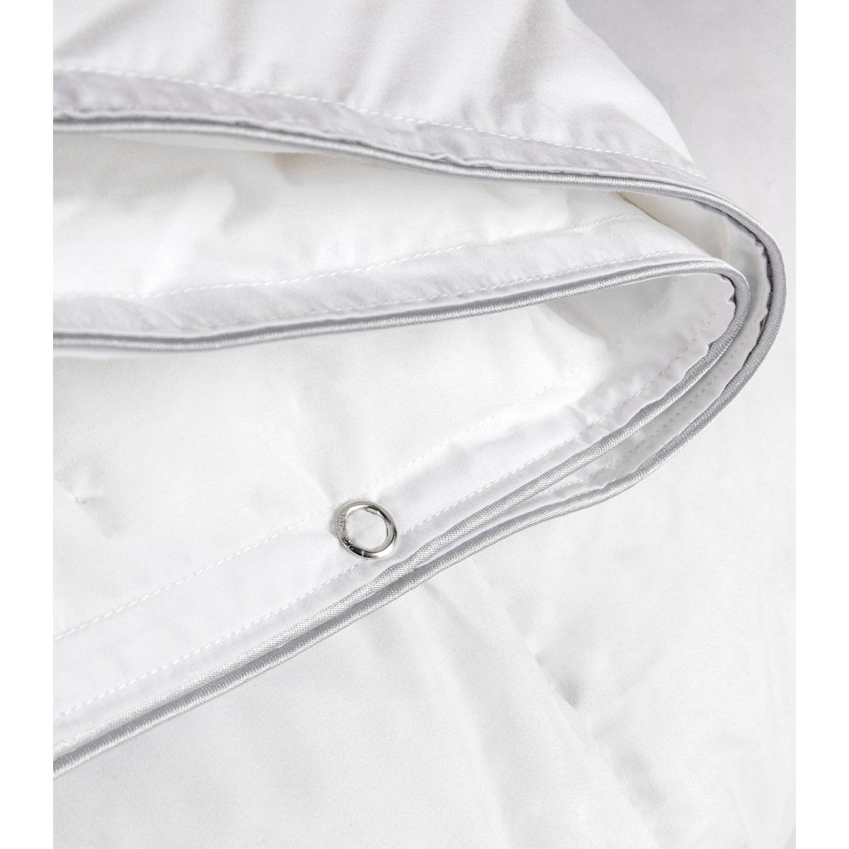 Close-up of the metal press-stud eyelet used to connect the two Prince Duo duvet layers together