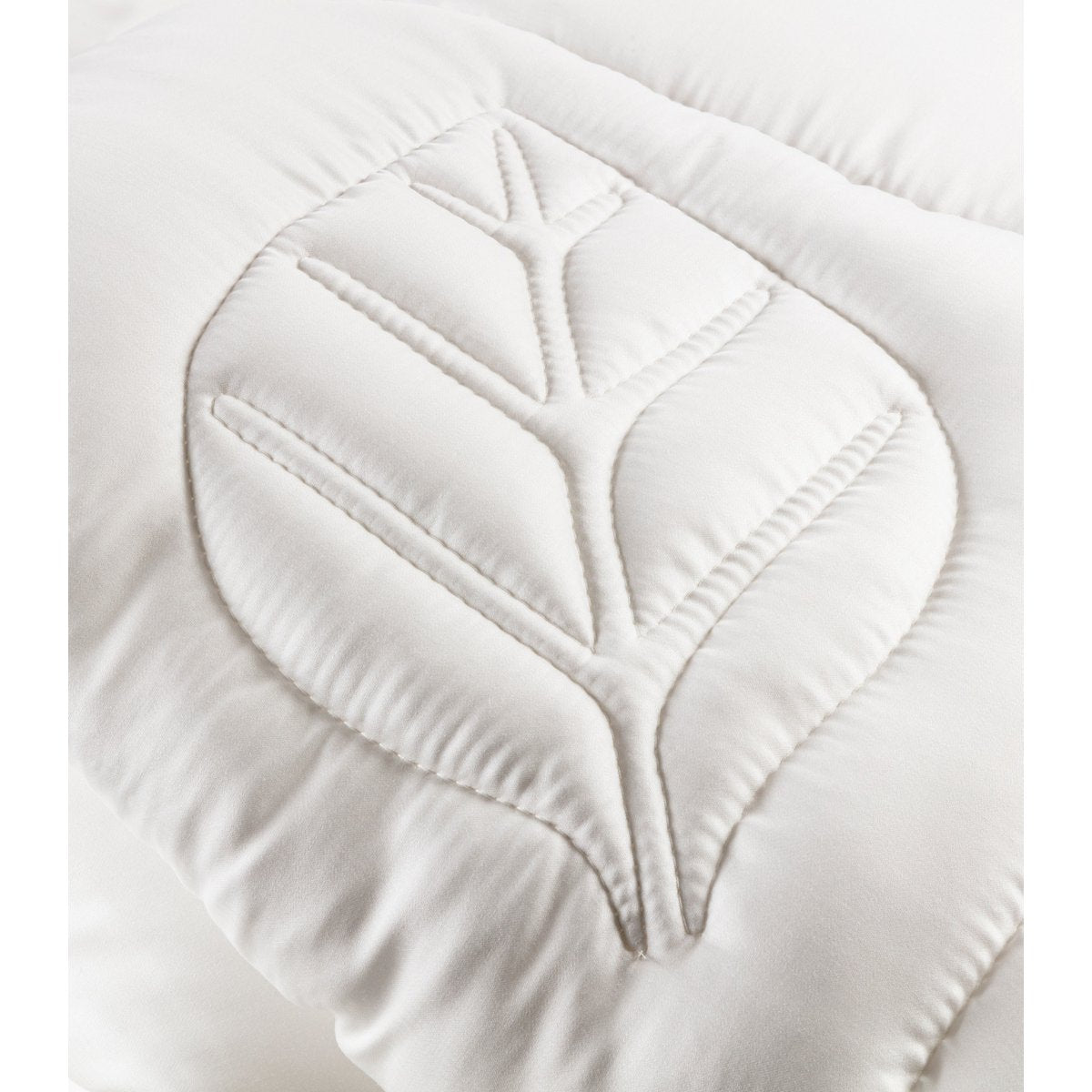 Close-up of the leaf-shaped quilting stitch pattern on the Tencel satin fabric of the Super Soft Duo duvet