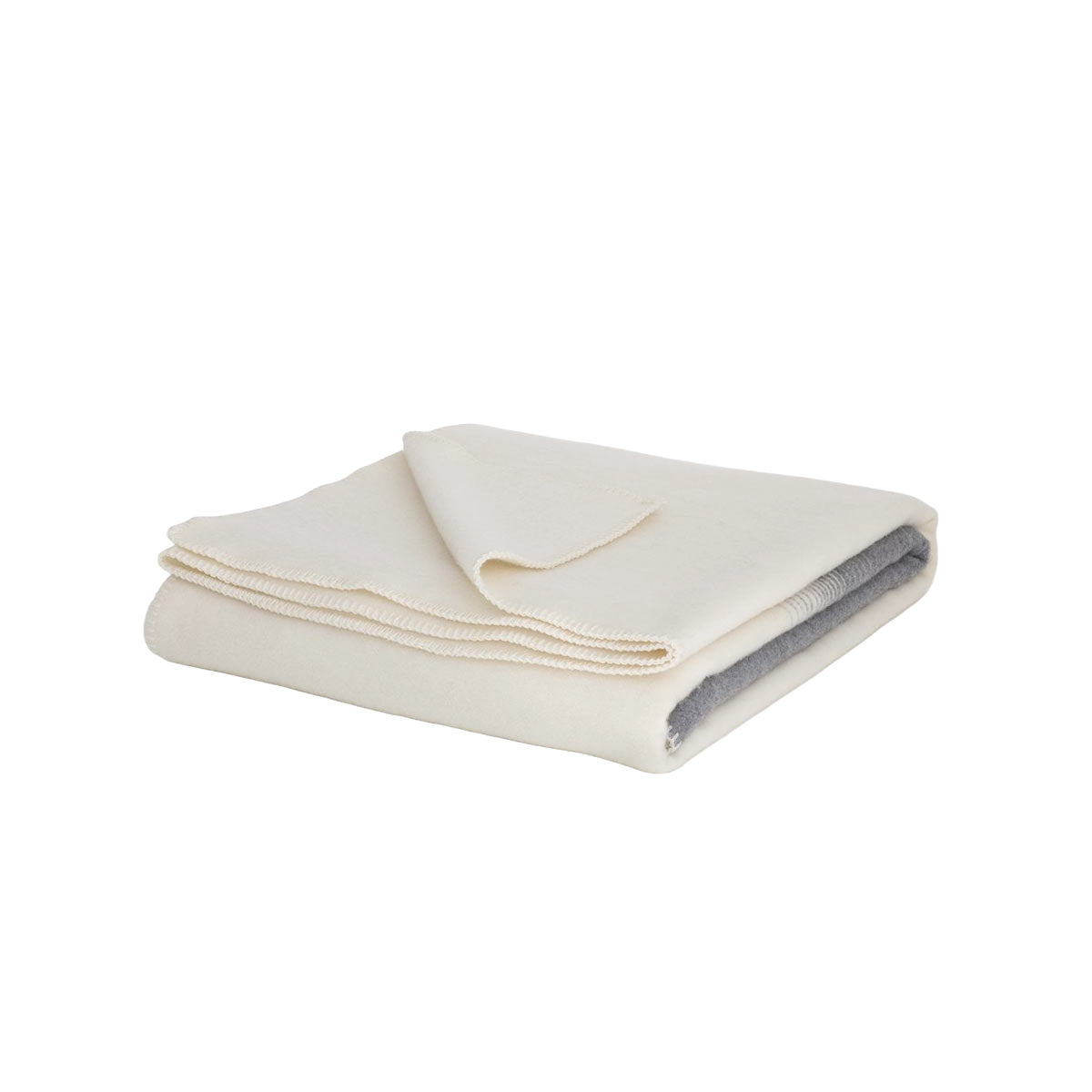 Folded Merino & Cashmere Bedspread Ivory Mist showing grey-to-white gradient