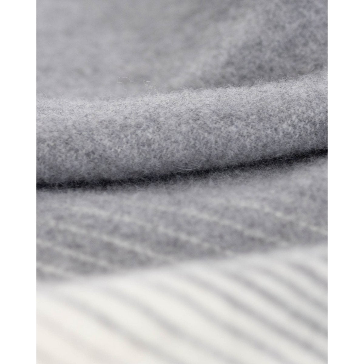 Close-up of Ivory Mist bedspread's soft woven texture