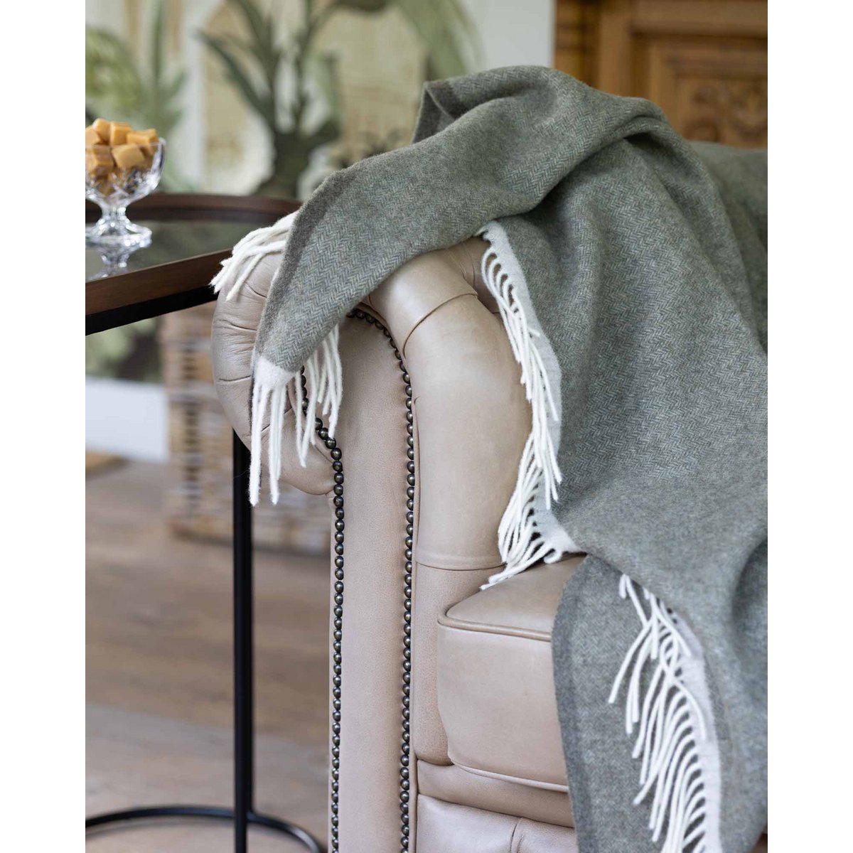 Merino & Cashmere Throw Blanket Milano Verde Orlo styled in a room setting