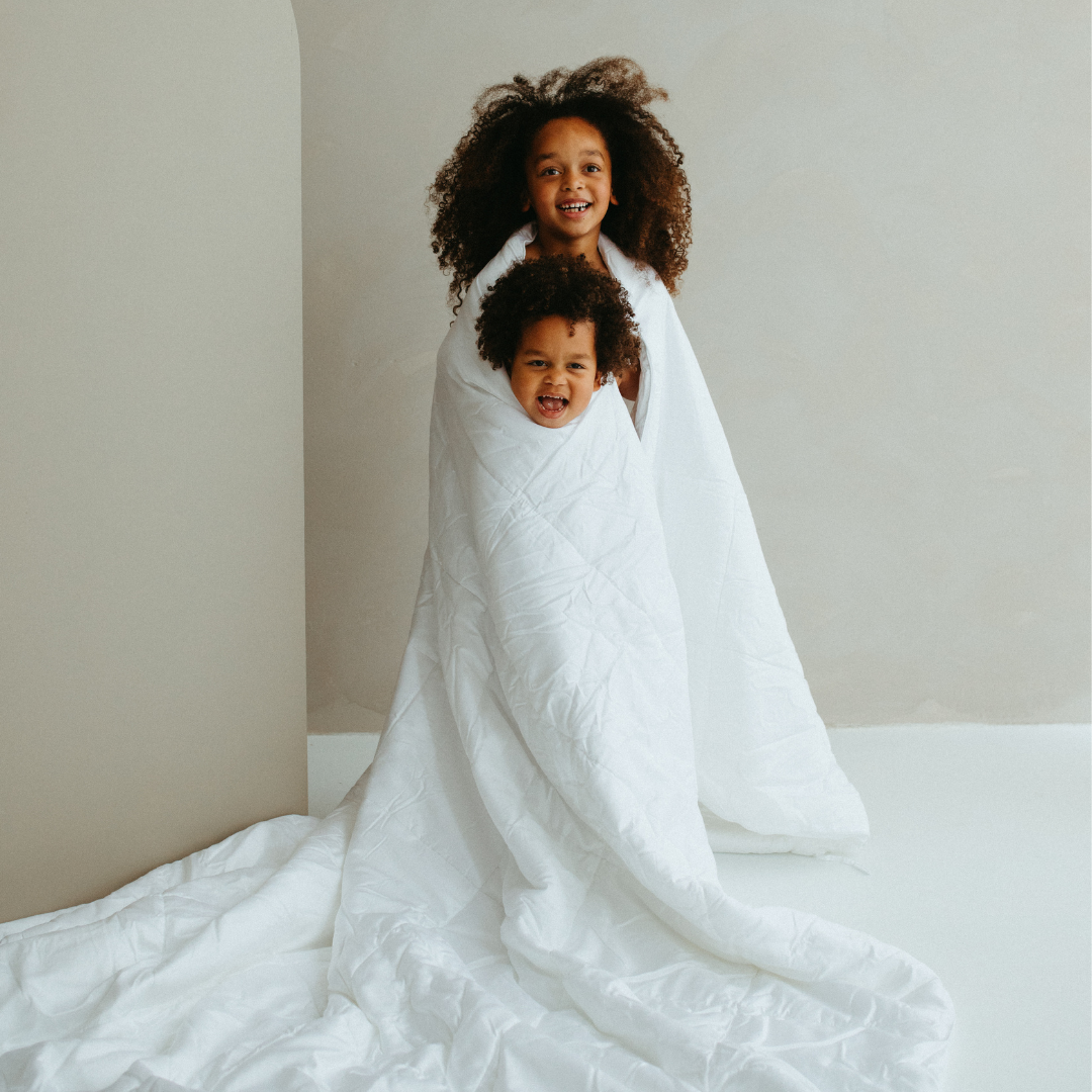 Person wrapped in the Tencel™ Four Seasons Duvet