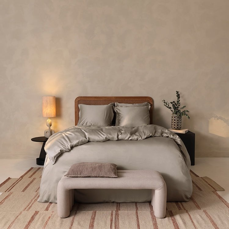 Tencel™ Sateen Duvet Cover in Taupe styled on a bench at the foot of a bed