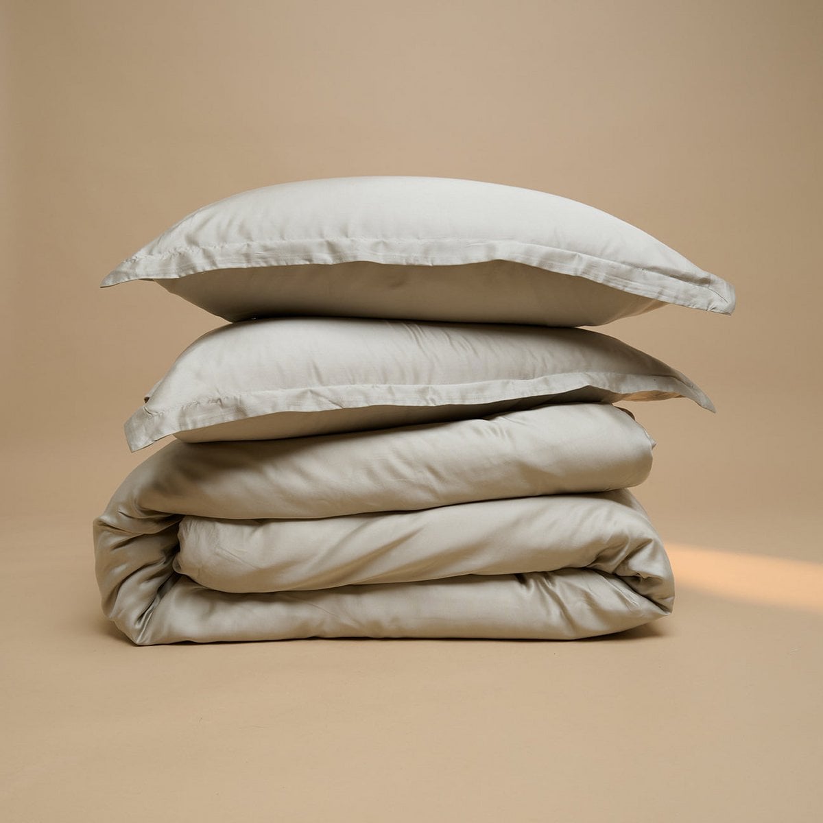 Tencel™ Sateen Duvet Cover and pillow in Taupe, folded